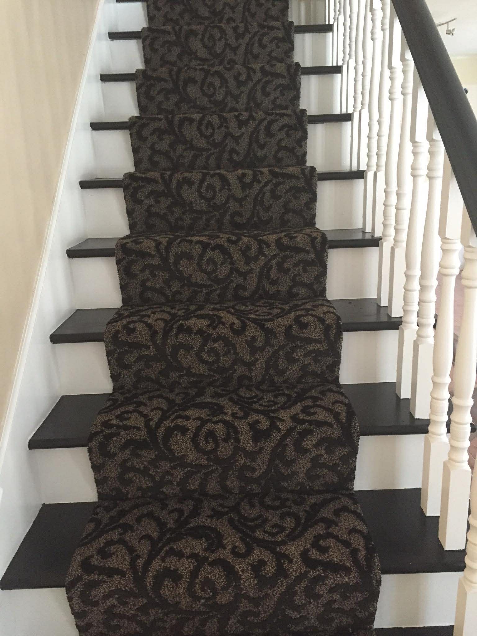 Dark damask pattern carpet on stairs