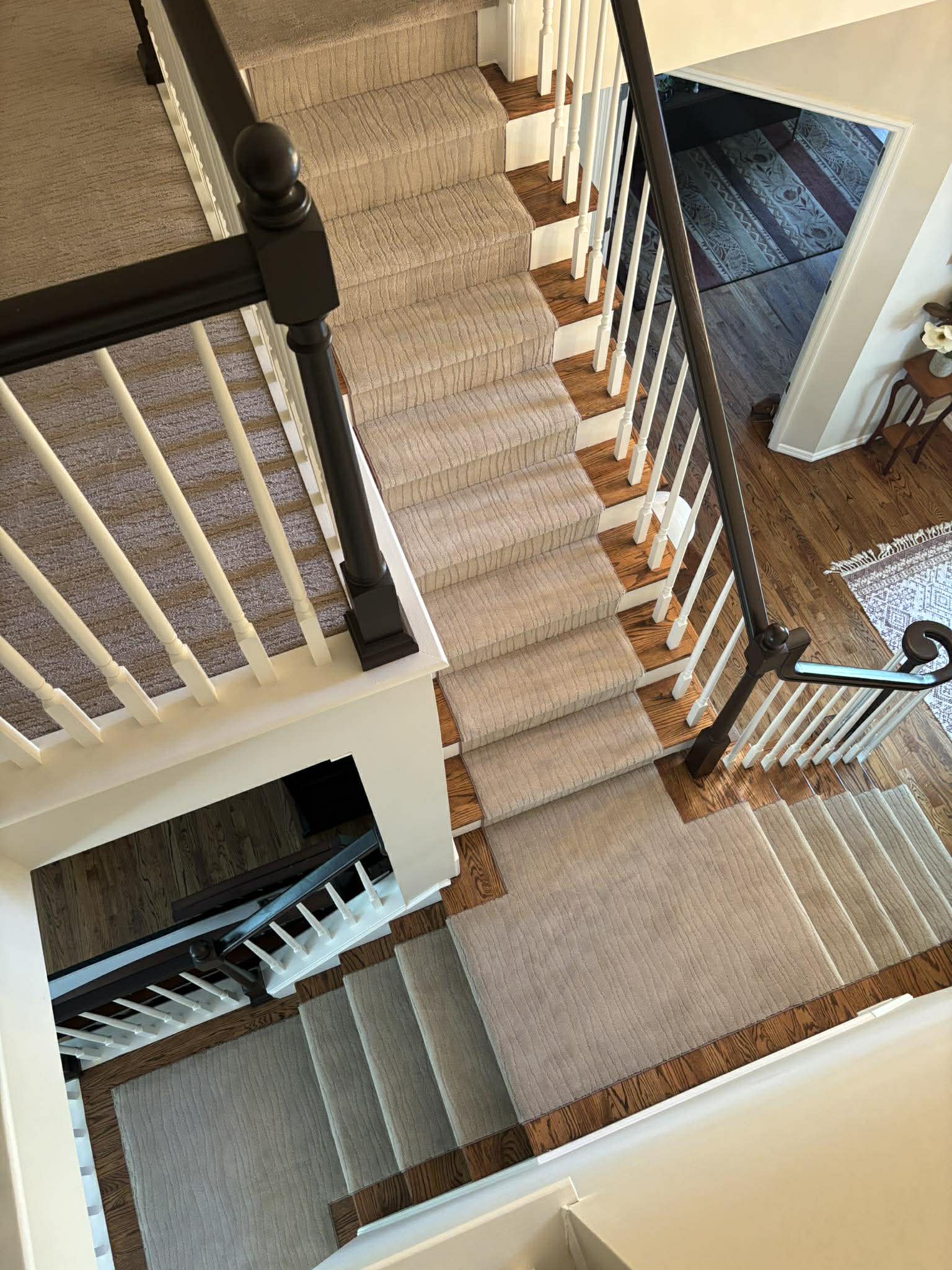 Neutral gray carpet on stairs viewed from above