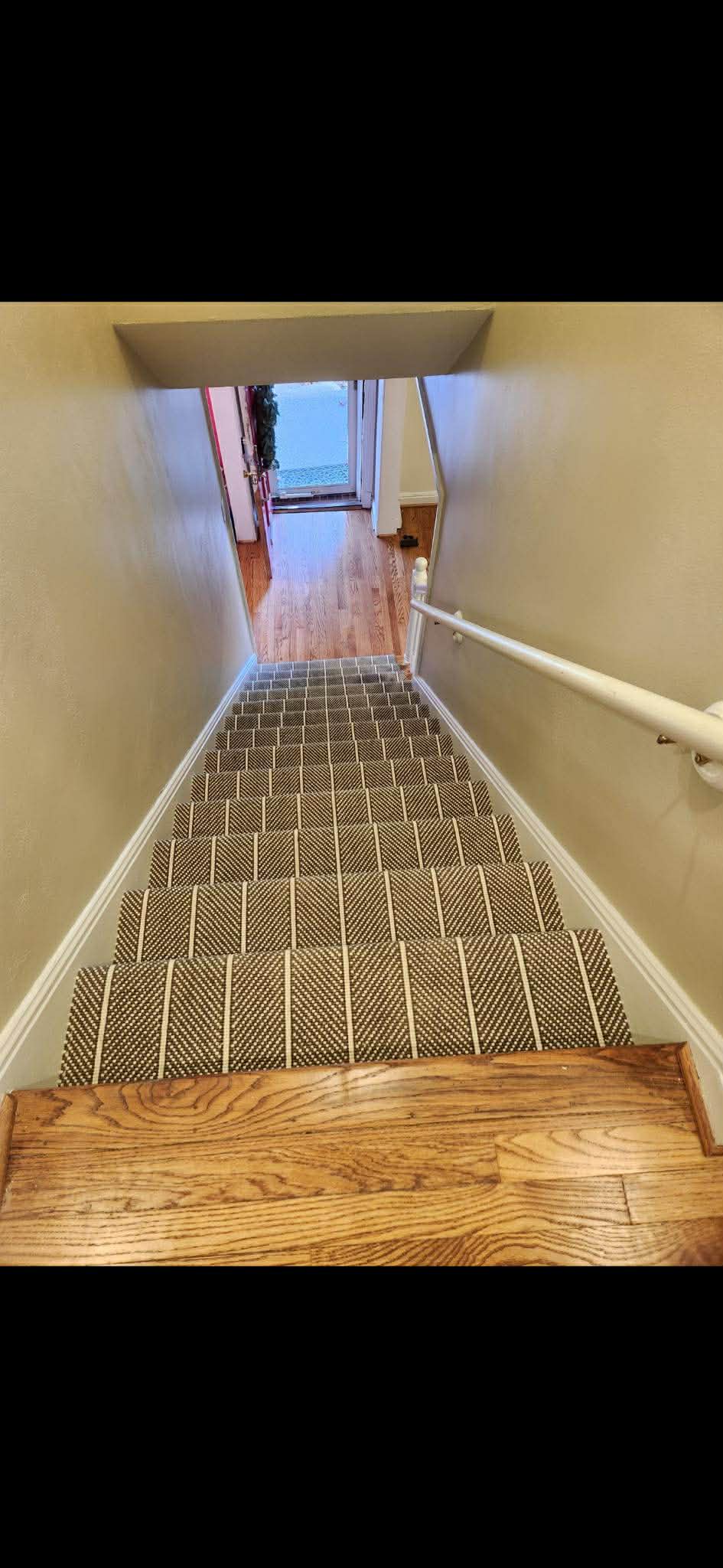 Navy geometric carpet on narrow stairs
