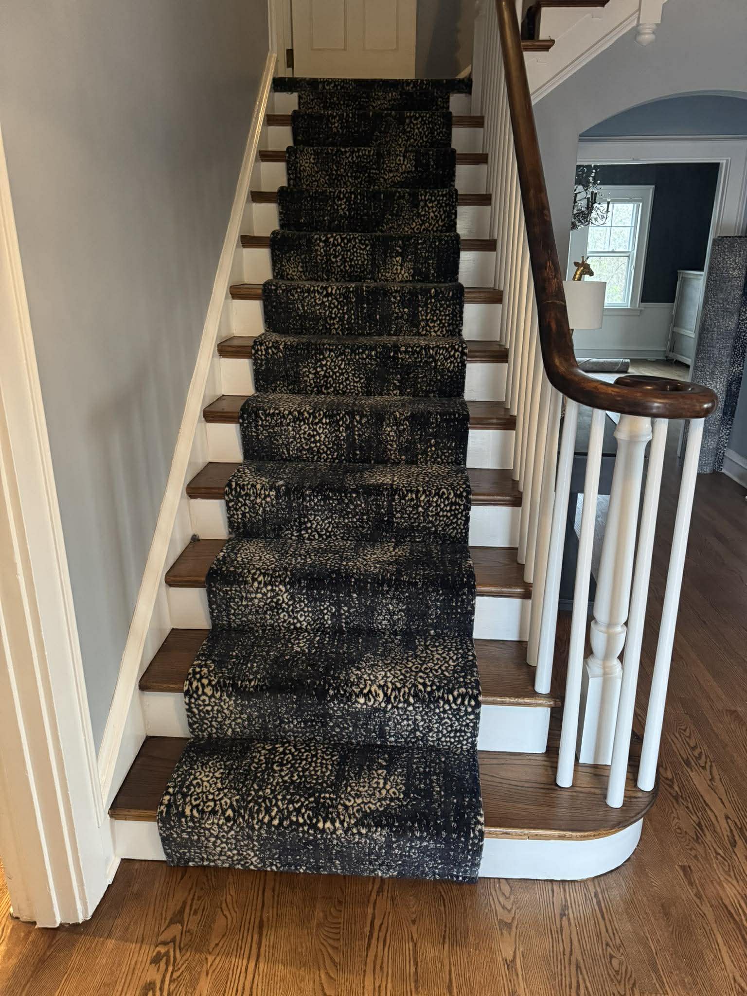 Black leopard print carpet on stairs side view