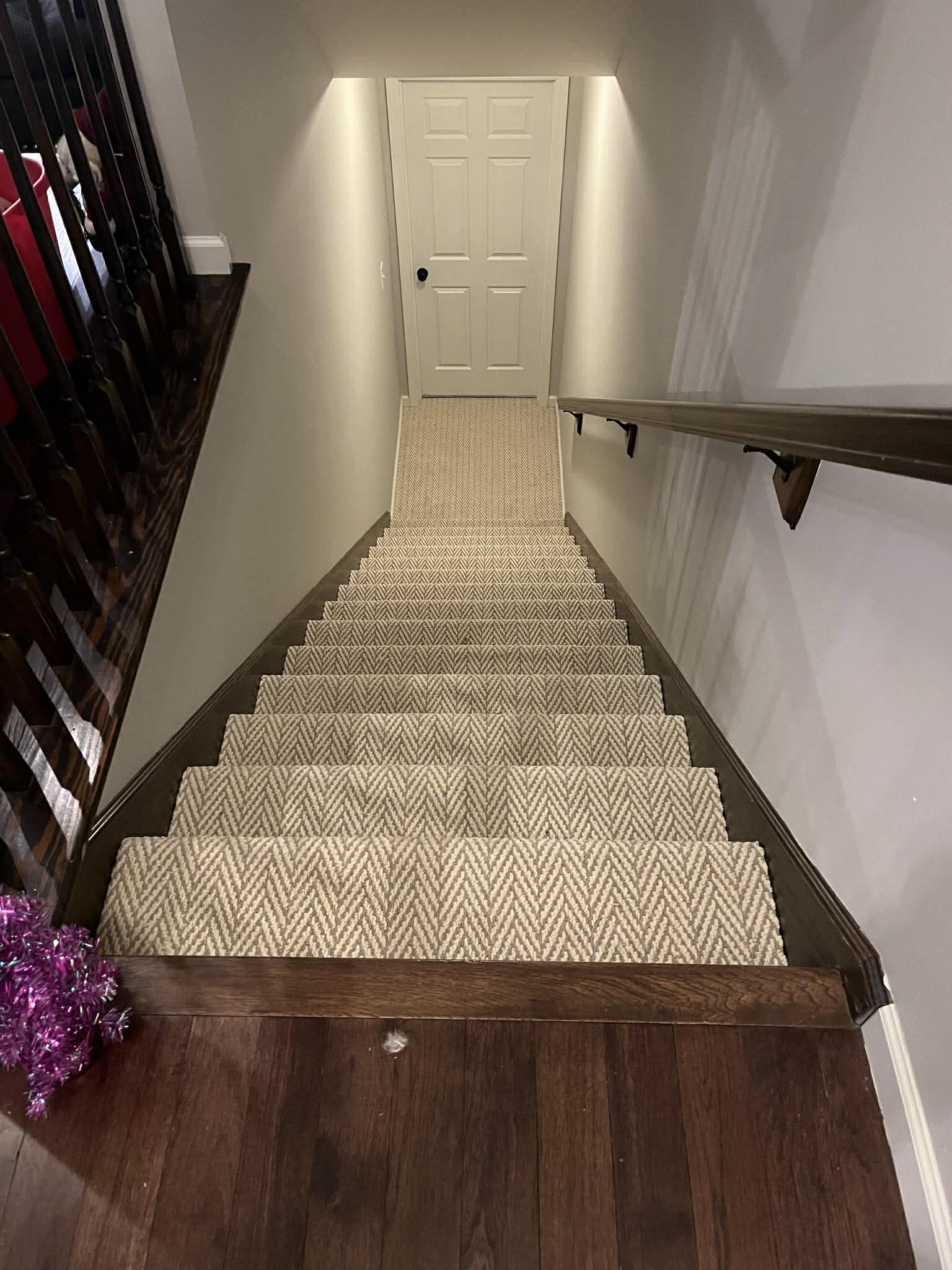 Beige herringbone carpet on stairs